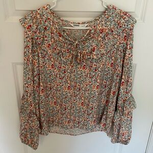 Size small floral top long sleeve with tie in front.